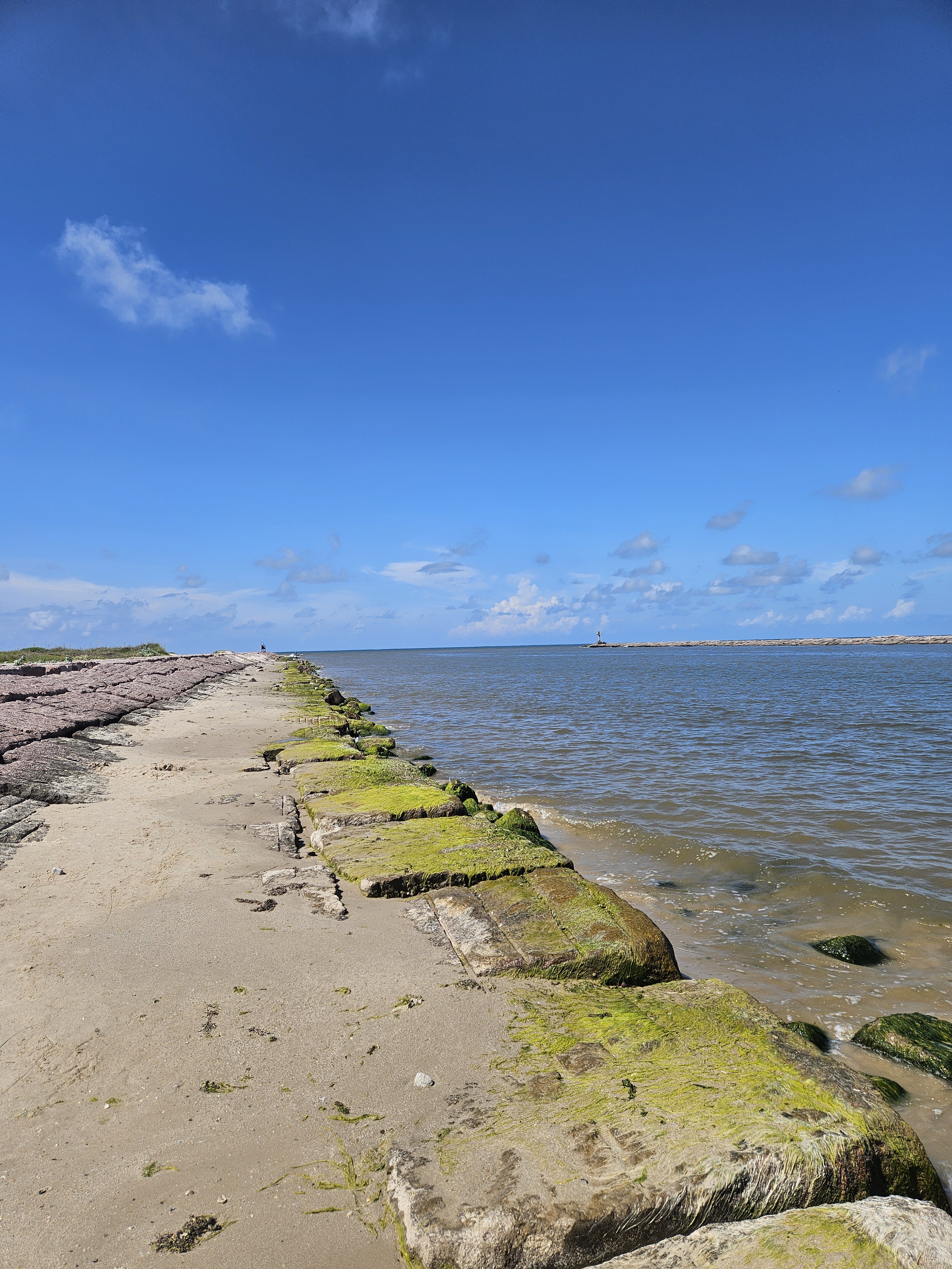 Rock levee where the Colorado River meets the Gulf at Matagorda