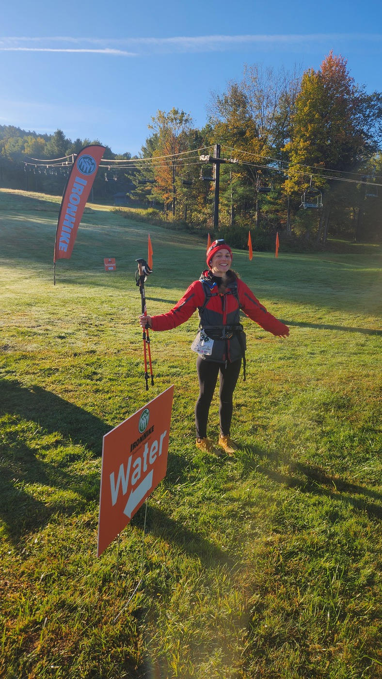 Smiling IronHike Mountain Athlete with trekking poles on a bright fall morning, Mohawk Mountain Cornwall CT