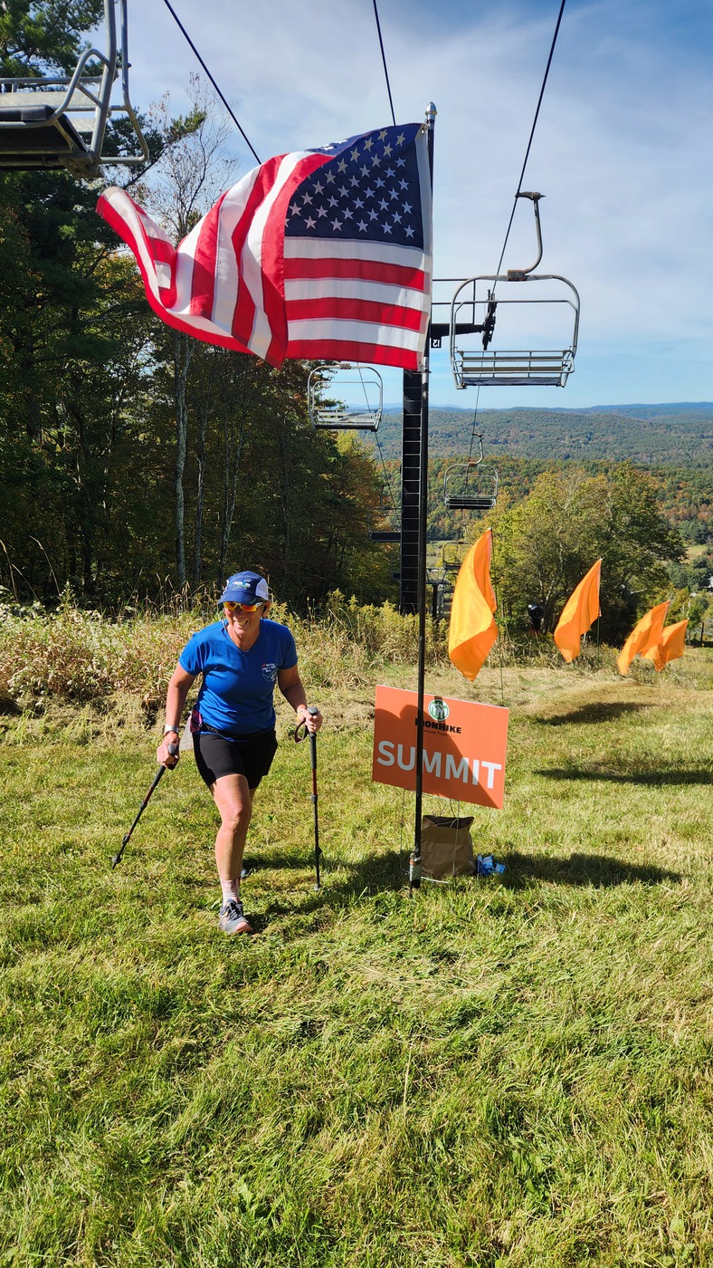 IronHike Mountain Athlete reaching the summit flag above the Litchfield Hills, Mohawk Mountain Cornwall CT