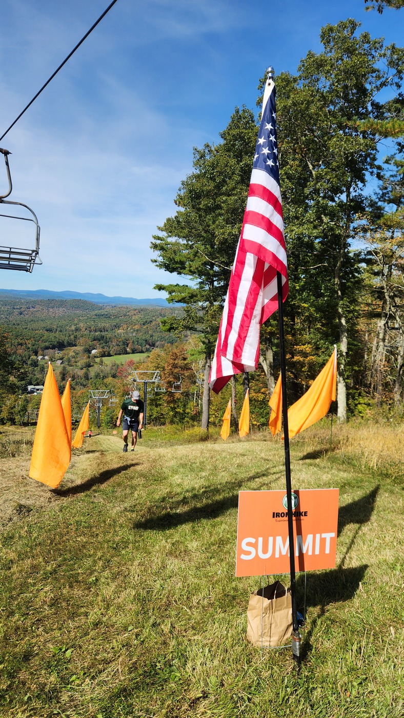 IronHike summit sign and American flag with a view over the Litchfield Hills, Mohawk Mountain Cornwall CT