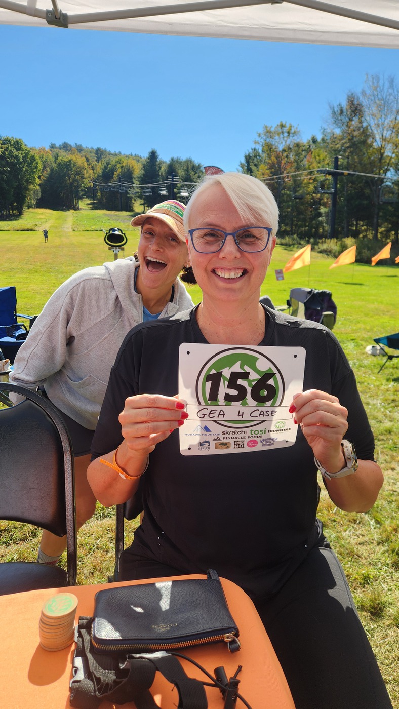 Two laughing IronHike Mountain Athletes at check-in, Mohawk Mountain Cornwall CT