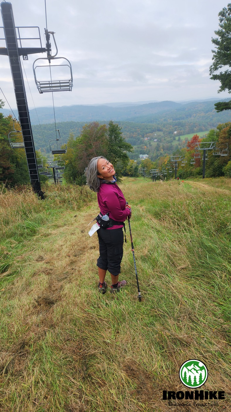 IronHike Mountain Athlete on the fall ski slope with the valley behind her, Mohawk Mountain Fall Series Cornwall CT