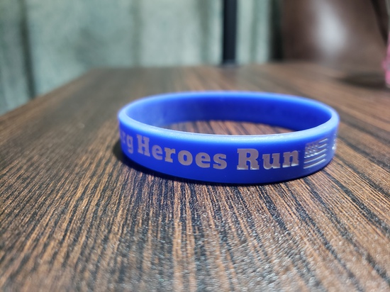 View Free blue bracelet for 1st 100 finishers of 1mi Legacy Loop in new tab
